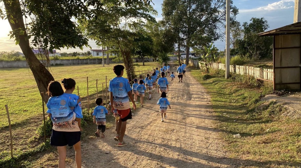 Margie Grainger and Hand to Hand children on the Annual Community Walk